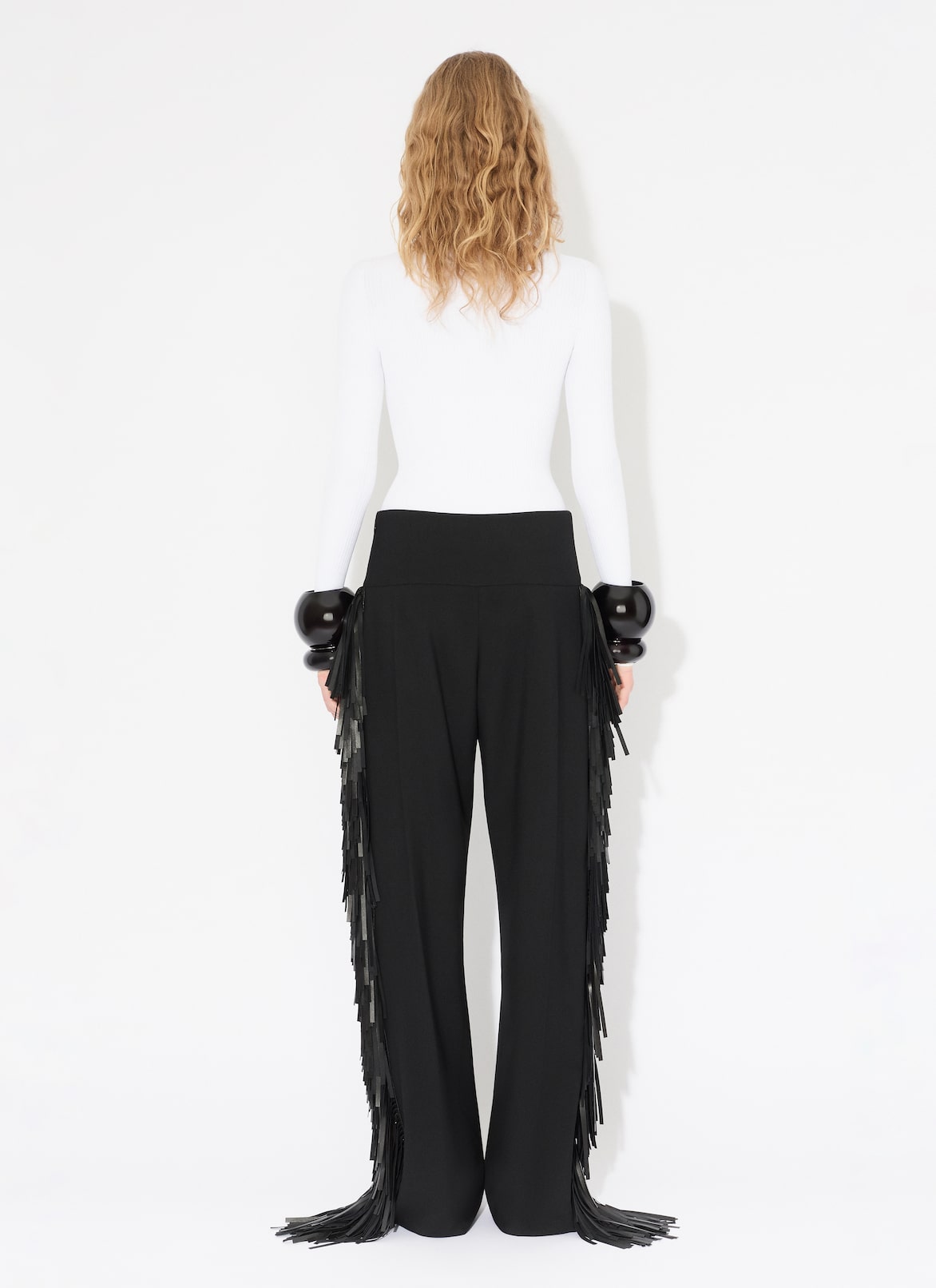 FRANSENHOSE AUS WOLLGABARDINE ALAÏA SCHWARZ FRANSENHOSE AUS WOLLGABARDINE